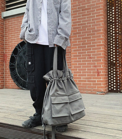 Fashion Work Canvas Drawstring Bag Backpack in hand