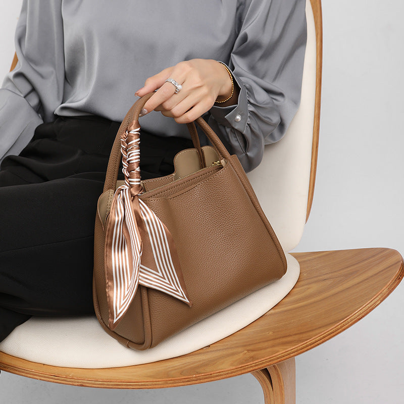 Elegant Genuine Leather Shoulder Bag for Women in hand